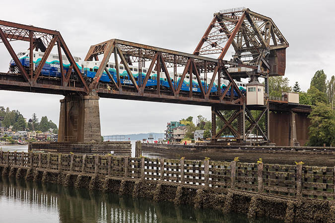 A Sounder train crosses a bridge in Seattle. A Sounder train crosses a bridge in Seattle.
